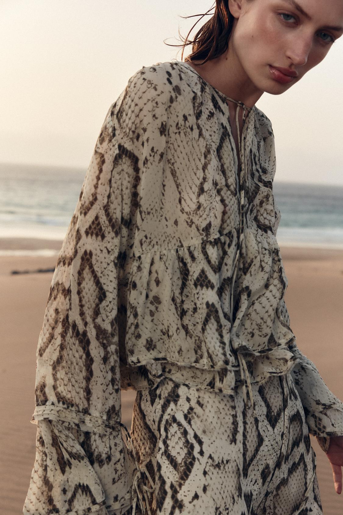 SEMI-TRANSPARENTE BLUSE MIT ANIMAL-PRINT