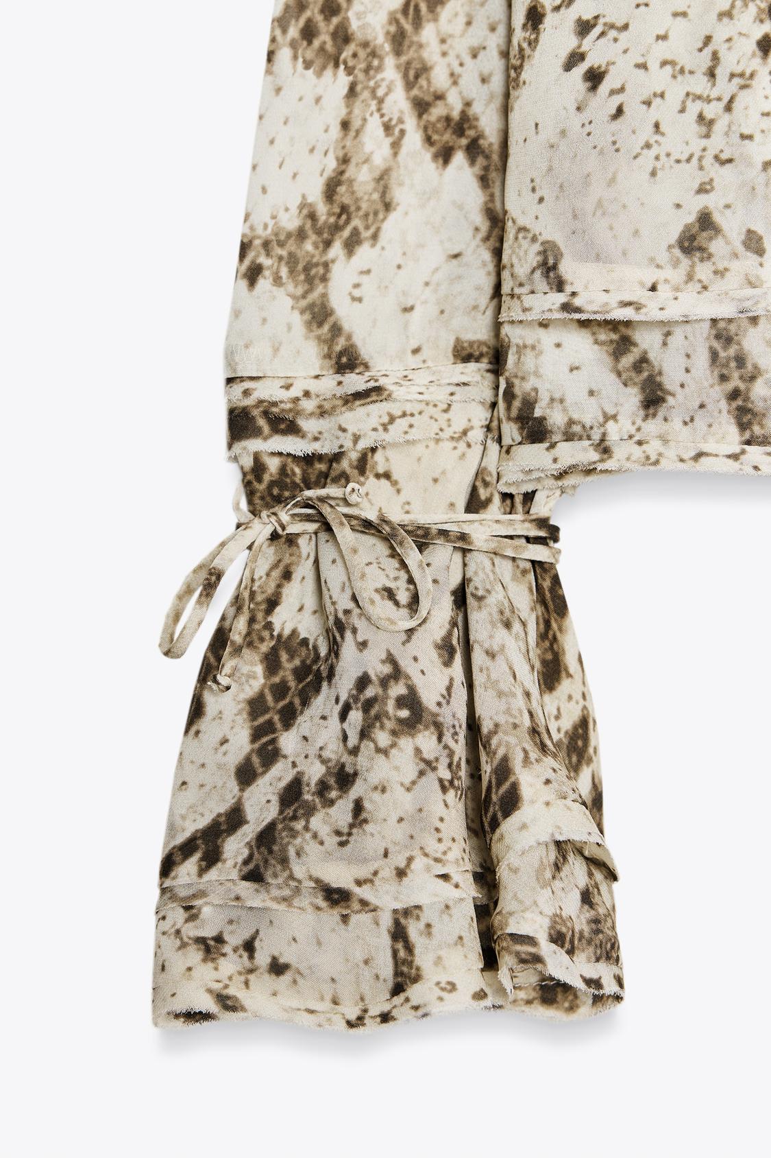 SEMI-TRANSPARENTE BLUSE MIT ANIMAL-PRINT