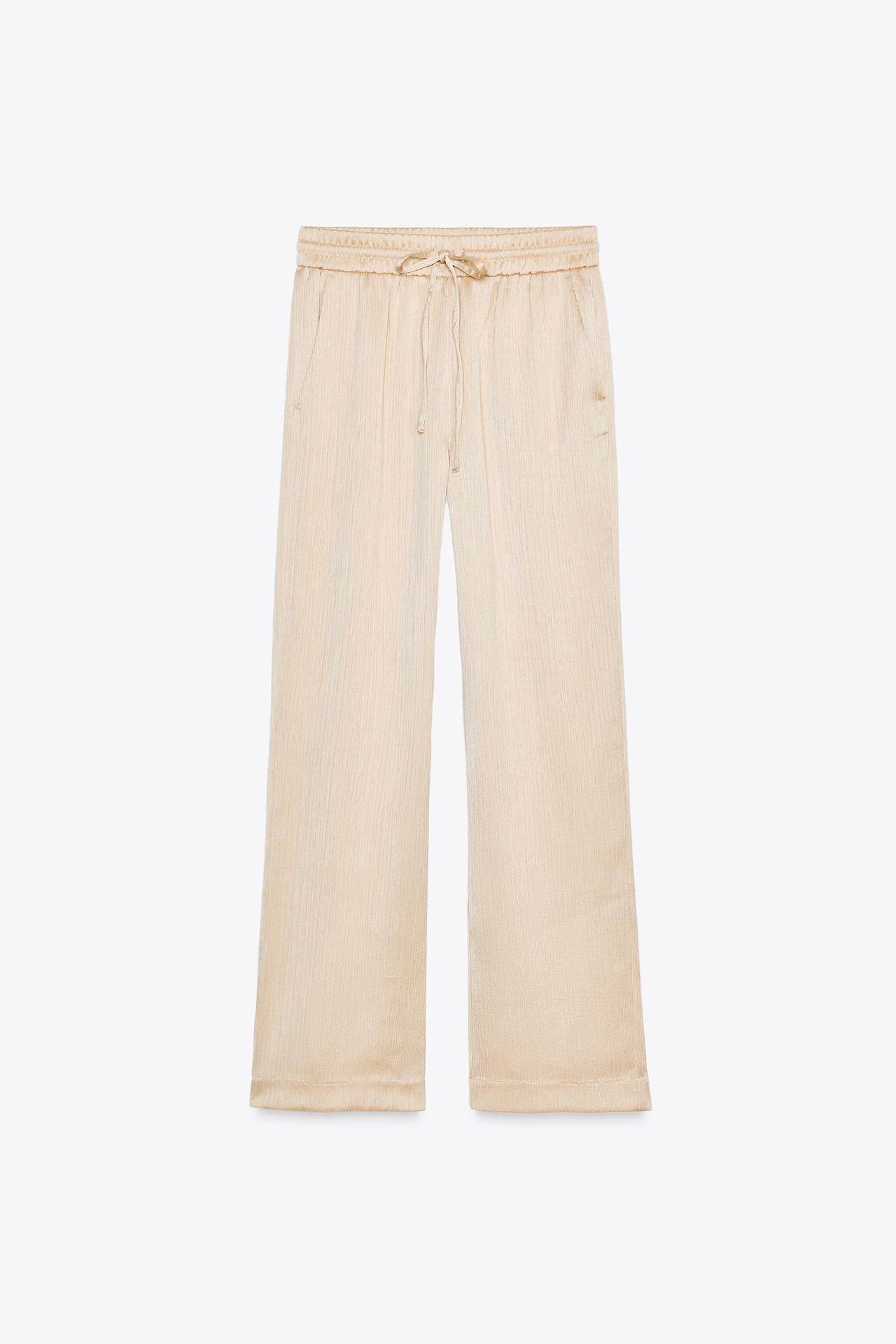 WEITE HOSE MIT FLUIDER SILHOUETTE IN BEIGE