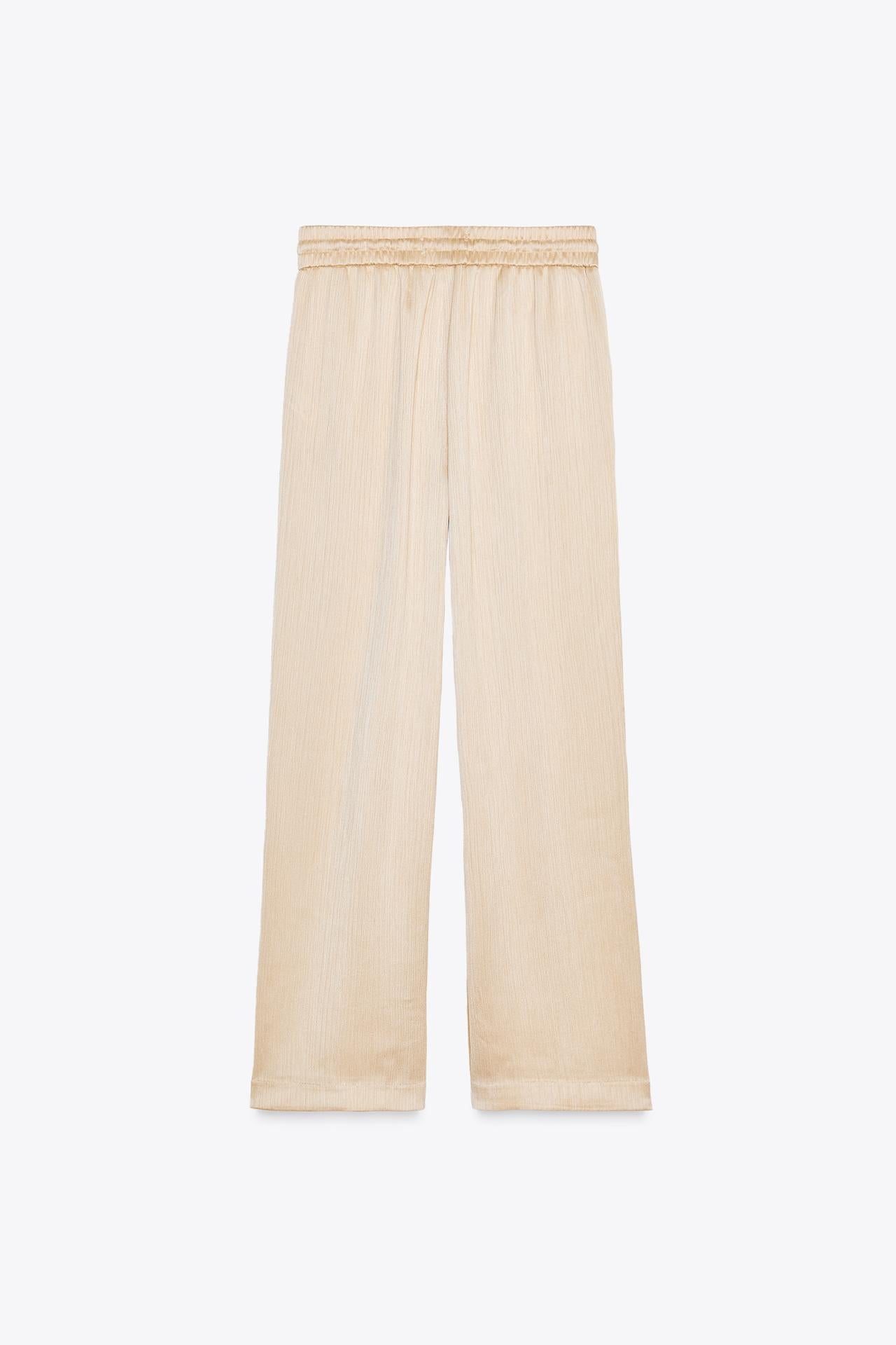 WEITE HOSE MIT FLUIDER SILHOUETTE IN BEIGE